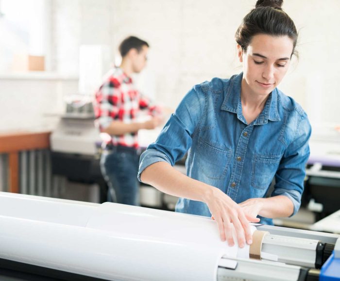 woman-loading-wide-format-printer-TCPVNAJ.jpg